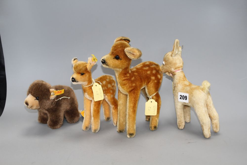 A Steiff Browny bear, a 1950s Steiff deer and two other deer